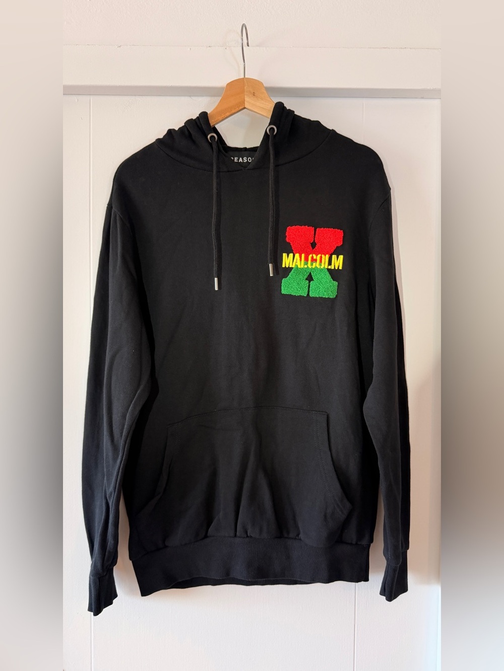 85 Reason Black Hoodie with Red, Yellow & Green Malcolm X Logo